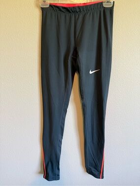Nike Grey Leggings with Orange Trim and White Swoosh